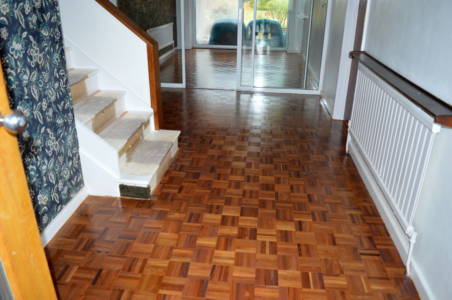 Gloss lacquer applied onto sanded finger parquet floors
