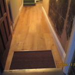 Floor fitting around door mat