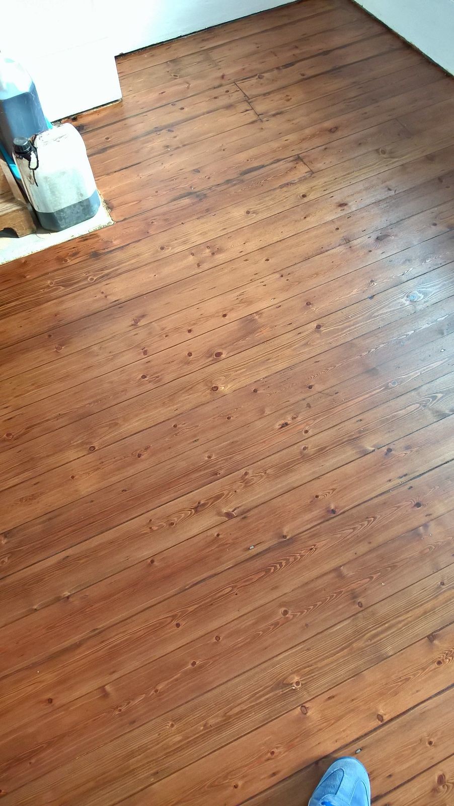 Mid oak stain applied to floor boards